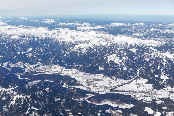 Black mountains covered by snow . Swiss Alps winter panorama - 写真・画像
