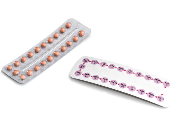 Pillola contraccettiva orale su sfondo bianco
 - Foto, immagini