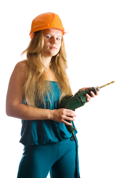 Girl in hard hat with drill - Foto, afbeelding