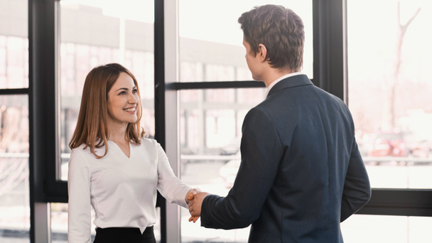 happy woman shaking hands with employer after job interview - Photo, Image