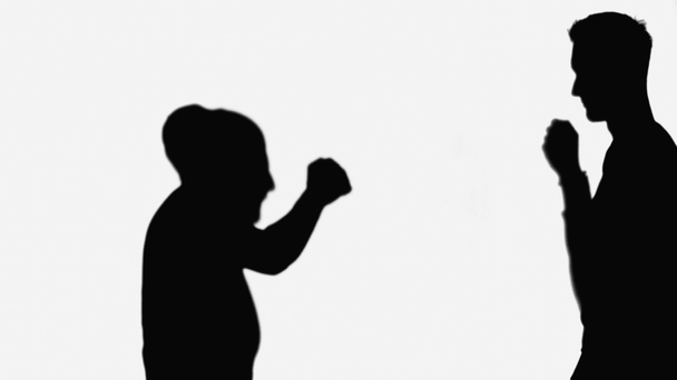 silhouettes of friends going to do fist bump while greeting each other isolated on white - Foto, Bild