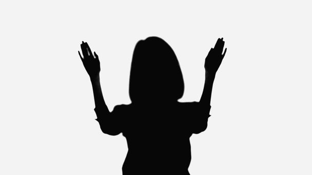 silhouette of woman waving hands isolated on white - Φωτογραφία, εικόνα
