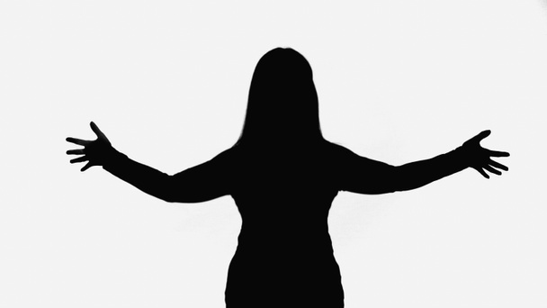 чорний силует жінки, що стоїть з відкритими руками ізольовано на білому
 - Фото, зображення