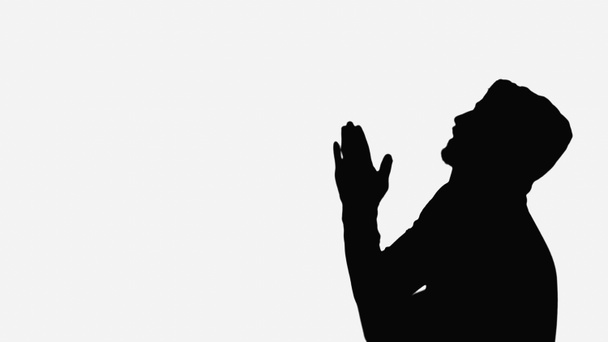 black shadow of man with praying hands isolated on white - Фото, изображение