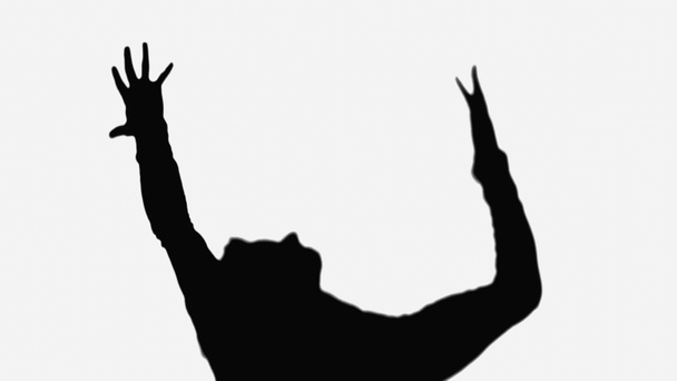shadow of man showing rejoice gesture with raised hands isolated on white - Foto, afbeelding