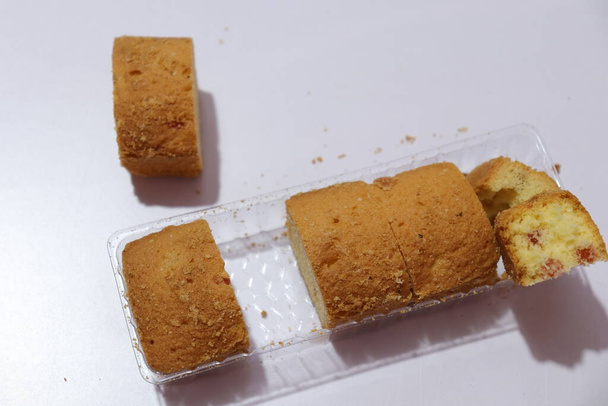 Plum cake cut pieces Isolated on white background  - Photo, Image