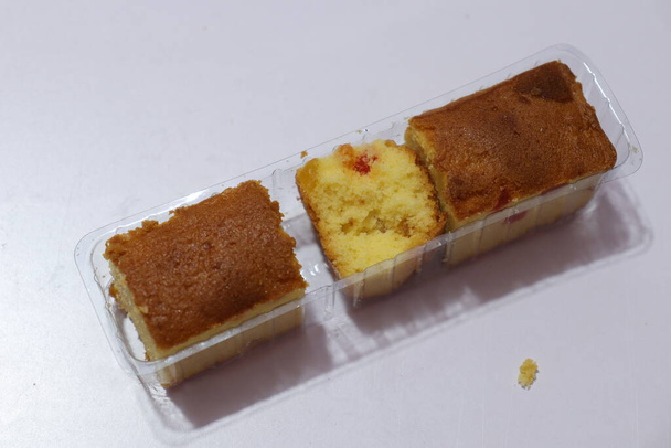 Plum cake cut pieces Isolated on white background  - Фото, изображение
