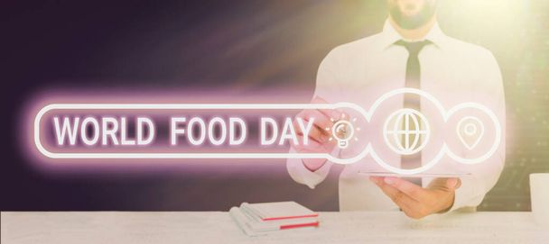 Текст почерка World Food Day, Business showcase World day of action dedicated to tackling global hunger Colorful Pegs Placed Around Speech Bubble with important information. - Фото, изображение
