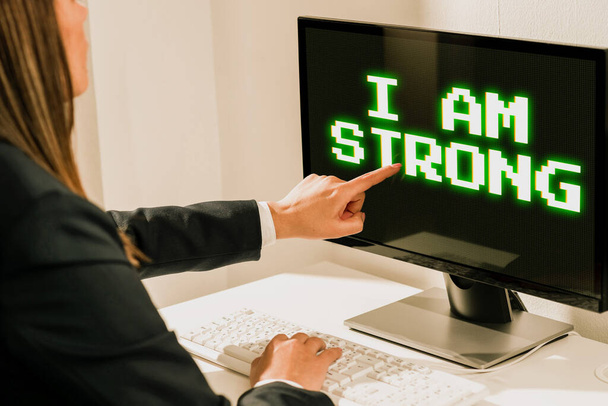 Writing displaying text I Am Strong, Business approach Have great strength being healthy powerful achieving everything Female leader holding a megaphone expressing encouraging ideas. - Photo, Image