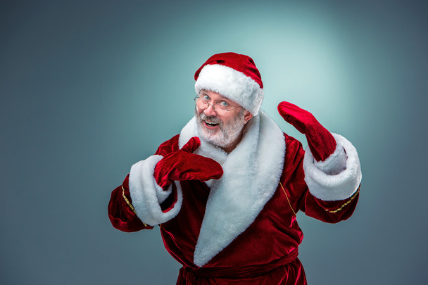 Santa Claus, presenting something. - Zdjęcie, obraz