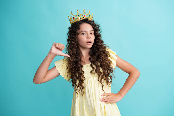Teen child in queen crown isolated on blue background. Princess girl in tiara. Teenage girl wear diadem - Foto, Imagem