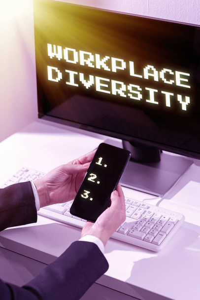 Text caption presenting Workplace Diversity, Word Written on Different race gender age sexual orientation of workers Piece Of Carboard With Important Message Surrounded By Colorful Paperclips. - Photo, Image
