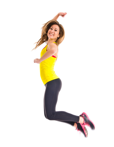 Sportlerin springt über weißen Hintergrund - Foto, Bild