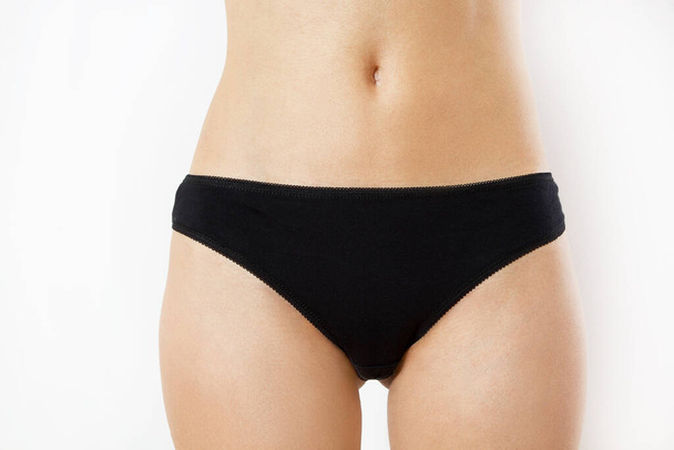 Lower body - Beautiful slim body of woman in lingerie, female black panties - Fotografie, Obrázek