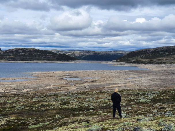 Norwegian person disapproving of the heavily drought influenced landscape. - Fotoğraf, Görsel