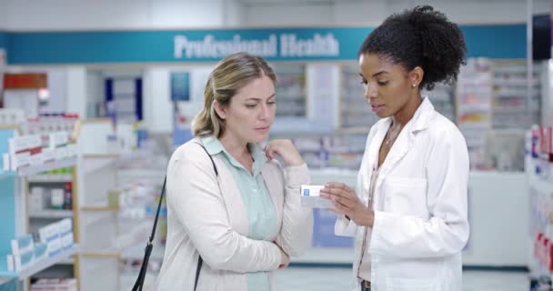 Doctor or pharmacist consulting customer or patient with medicine and professional advice at a pharmacy. Medical expert with great customer service, pills and health care treatment to woman in store. - Metraje, vídeo