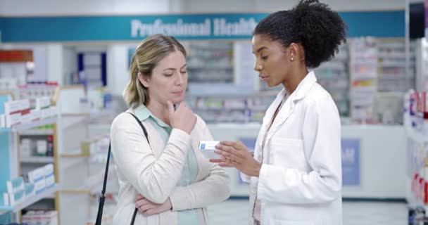 Pharmacist, customer and communication help for medicine, pharmacy healthcare product and insurance pills. Talking black woman, employee and wellness worker in a drugs retail store with medical trust. - Filmati, video