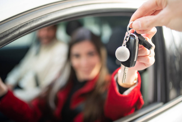 Young smiling woman taking her car keys - Photo, Image