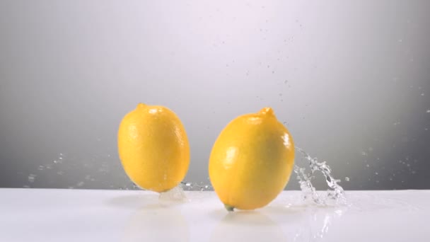 Whole lemons falling on water - Footage, Video