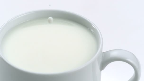 Milk dropping into a mug - Footage, Video