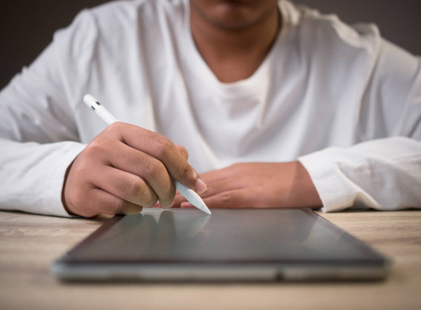 businessman using digital pen for digital tablet for Online working, E-learning, work from home - Foto, Bild