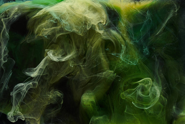 Liquid fluid art abstract background. Green dancing acrylic paints underwater, cosmic smoke ocean - Zdjęcie, obraz