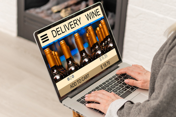Buying wines online, home delivery concepts. screen laptop computer on table with wine bottle. - Photo, Image