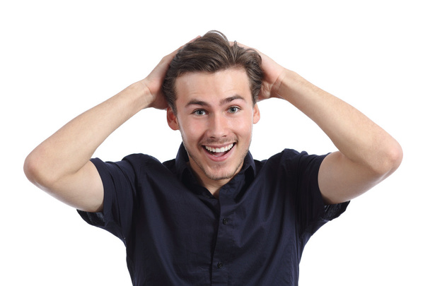 Surprised happy man smiling with hands on head - Photo, Image