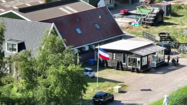Farmers protest in The Netherlands, dutch flag upside down. Protest actions by different groups of farmers. Goverenment wants to limit livestock farming to solve the nitrogen crisis. - Felvétel, videó