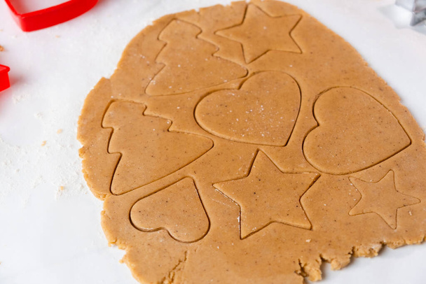 Making cookies in the shape of heart, Christmas tree, star from shortbread dough. - Φωτογραφία, εικόνα