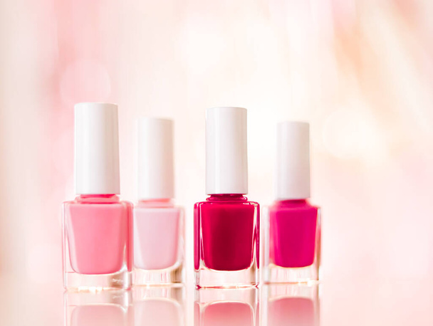 Shades of pink and red nail polish set on glamour background, nailpolish bottles for manicure and pedicure, luxury beauty cosmetics and make-up brand ad - Foto, Imagen