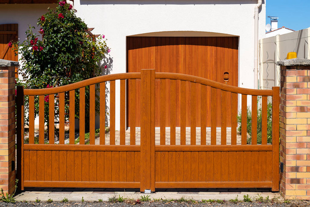 modern brown high gate aluminum portal outdoor of suburbs door house - Фото, изображение