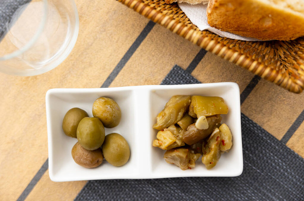 Pickled eggplant and olives appetizer closeup - Фото, зображення