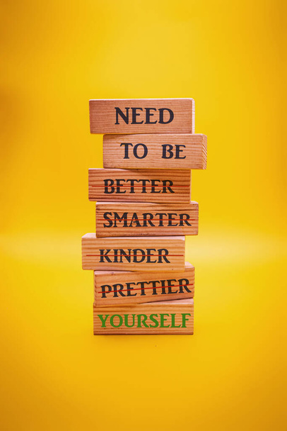 need to be myself text written on wood block yellow background - Foto, immagini