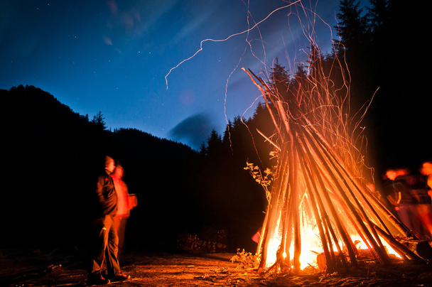 People beside campfire - Photo, Image