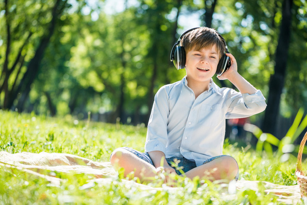 Boy enjoying music - Фото, изображение