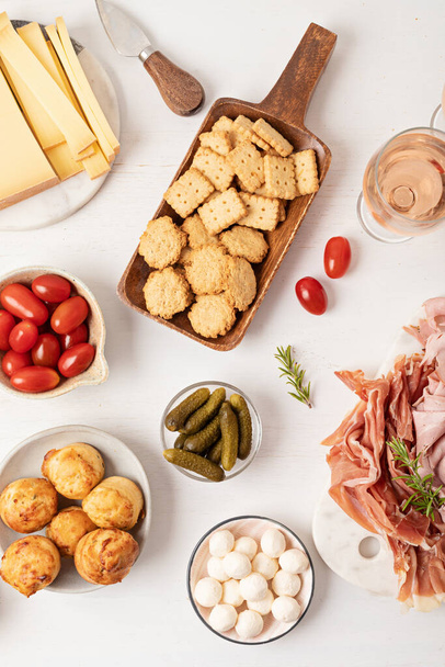 Appetizers table with different antipasti, charcuterie, snacks, cheese. Finger food for buffet party. Traditional french or italian entires. Top view - Foto, imagen