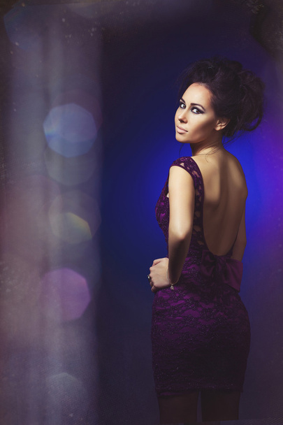 girl in a purple dress on background. Beauty women.Jewelry and b - 写真・画像