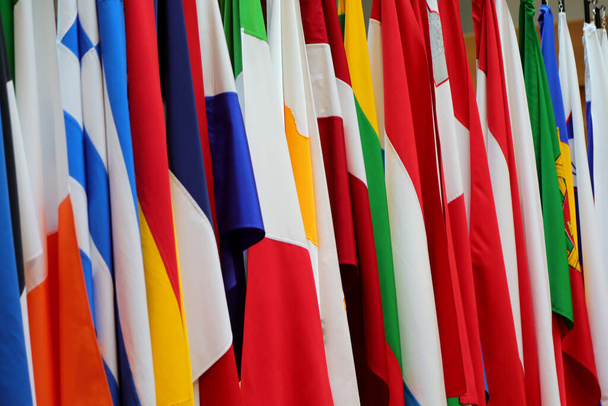 background with many international flags of many nations and different colors - 写真・画像