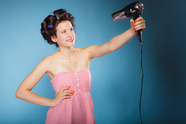 Woman holds hairdreyer - Φωτογραφία, εικόνα