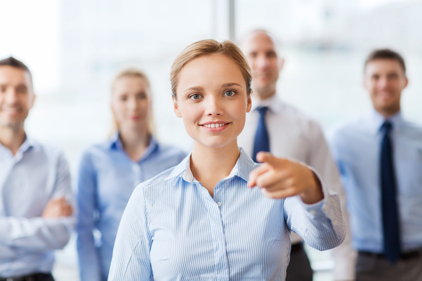 smiling businesswoman pointing finger on you - Foto, imagen