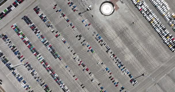 Top down aerial view of import and export car automobile storage in harbour port. Automotive industry new vehicles parked ready for shipping. - Záběry, video