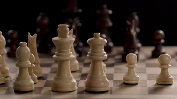A hand moving a piece on a chess board - Video, Çekim