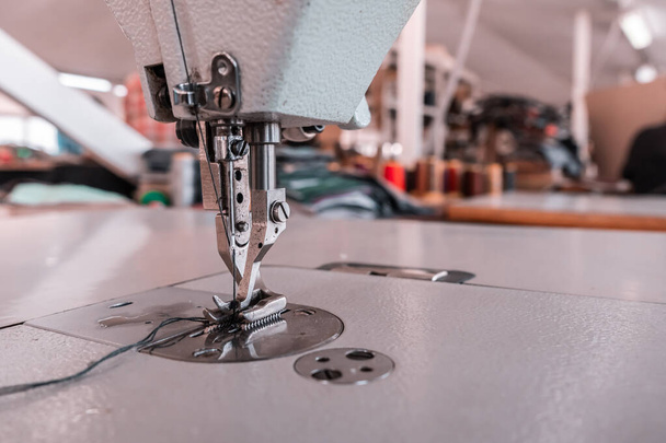 Sewing machine needles close-up in the workshop - Fotó, kép