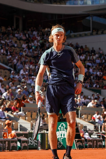 PARIS, FRANCE - JUNE 1, 2022: Professional tennis player Andrey Rublev of Russia  in action during his quarter-final match against Marin Cilic of Croatia at 2022 Roland Garros in Paris, France - Photo, image