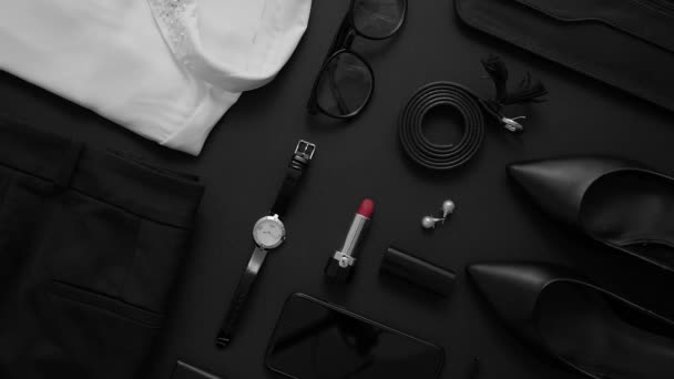Business woman styling objects set on black background, Top view. Flat lay concept - Séquence, vidéo