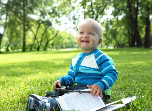 Portrait of little baby boy in the park - Foto, Imagem