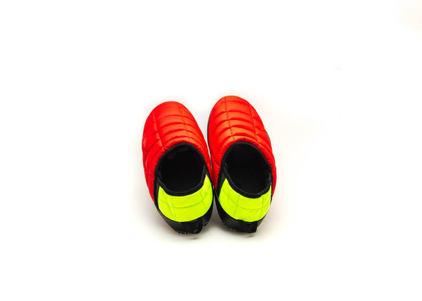 A pair of brand new red black green slip-on shoes mules isolated on white background. Ripstop upper, collapsible heel warmth and comfort sneaker footgear. - 写真・画像