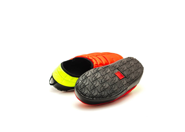 Brand new pair of red and green slip-on shoes mules with high-traction rubber outsole isolated on white background. Ripstop upper, collapsible heel warmth and comfort sneaker footgear. - Foto, Imagem