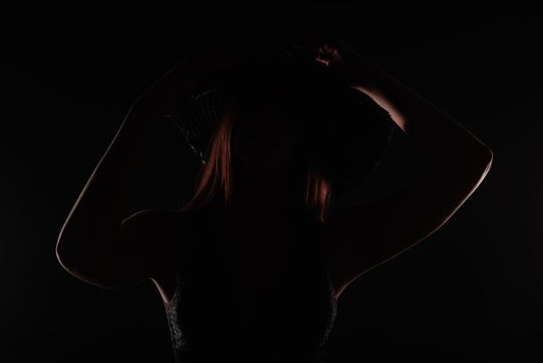 Perfect and dark silhouette of amazing and beautiufl girl posing, close up - Fotografie, Obrázek